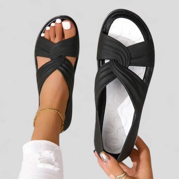 Women's Open Toe Flat Sandals with Twisted Crossover Straps and Closed Heel